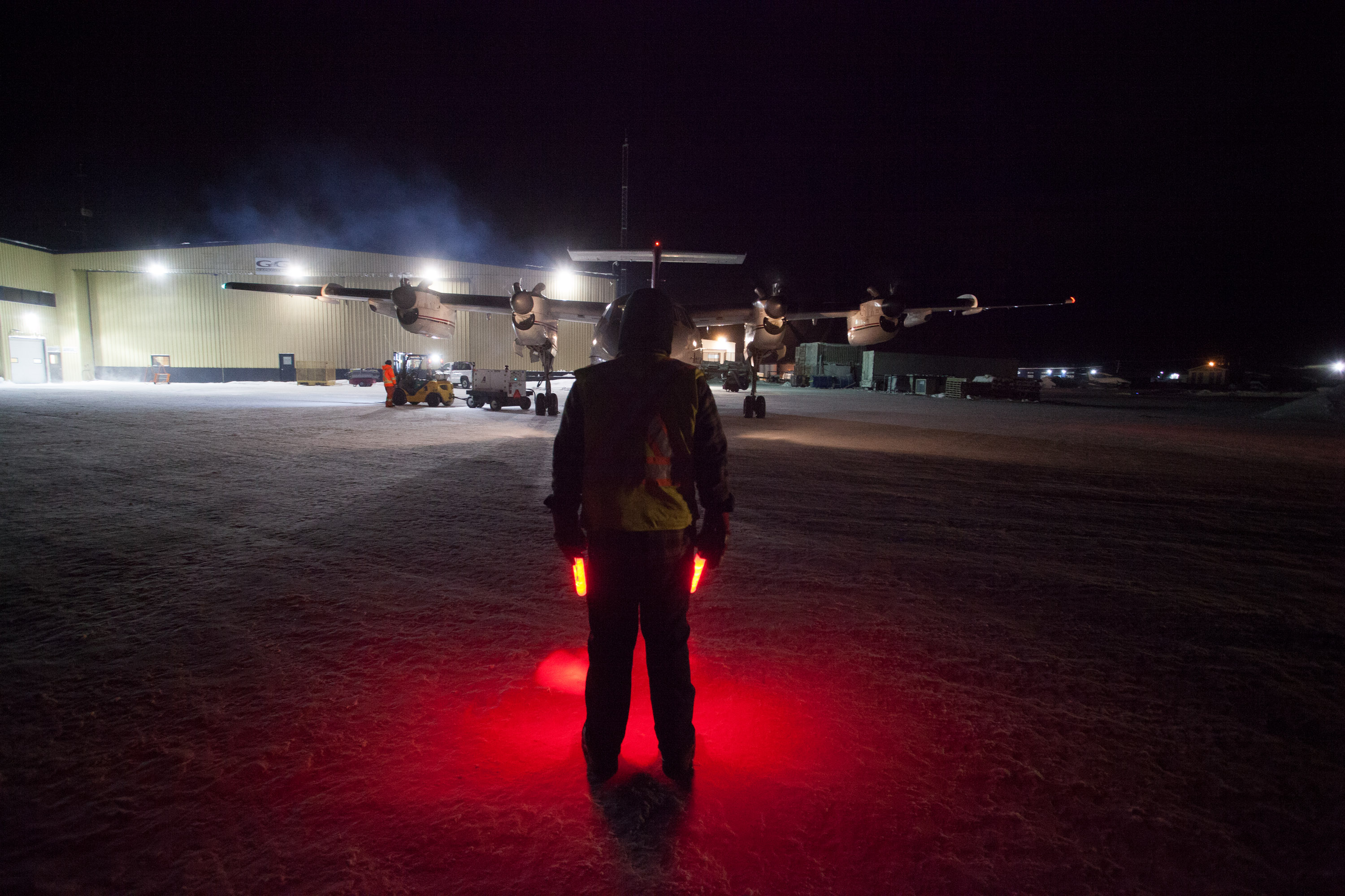 Air Tindi aircraft on a floodlit night ramp